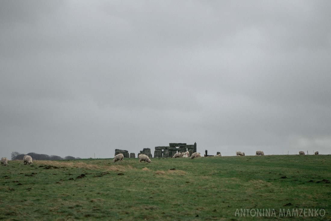 view of stonehenge through the fields