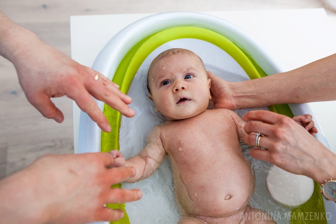 newborn baby boy having bath